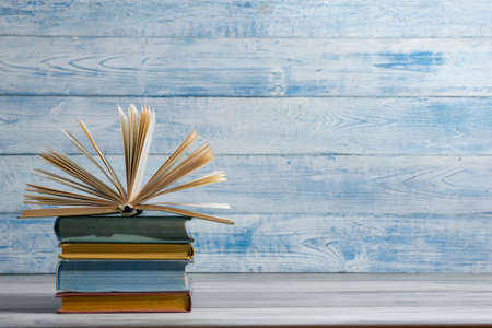 Open book, hardback books on wooden table. Back to school. Copy spaceの写真素材