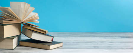 Open book, hardback books on wooden table. Back to school. Copy spaceの写真素材