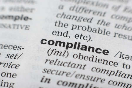 Dictionary definition of the word COMPLIANCE. Close-up shotの写真素材