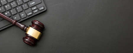 Judge gavel with computer keyboard. Concept of internet crime. Copy space for textの写真素材