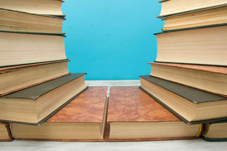 Open book, hardback books on wooden table. Back to school. Copy spaceの写真素材