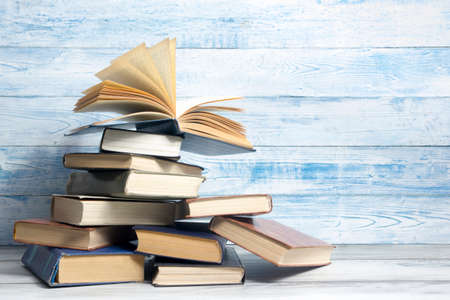 Open book, hardback books on wooden table. Back to school. Copy spaceの写真素材