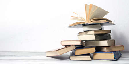 Open book, hardback books on wooden table. Back to school. Copy spaceの写真素材
