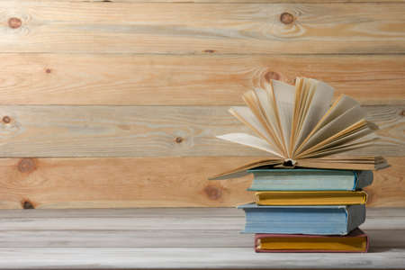 Open book, hardback books on wooden table. Back to school. Copy spaceの写真素材