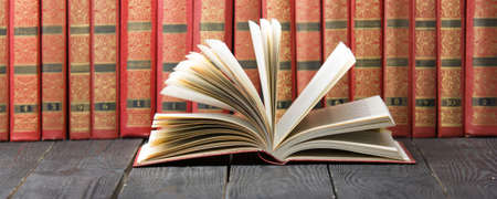 Open book, hardback books on wooden table. Back to school. Copy spaceの写真素材
