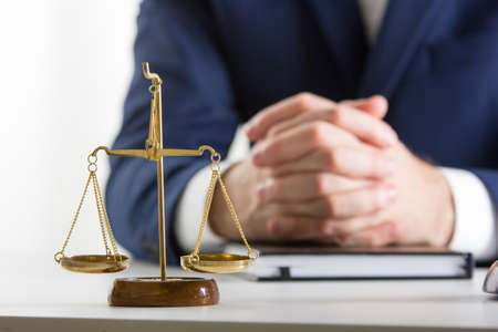 Lawyer working with contract papers and wooden gavel on tabel in courtroom. justice and law ,attorney, court judge concept.の写真素材