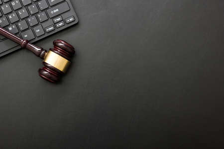 Judge gavel with computer keyboard. Concept of internet crime. Copy space for text.の写真素材