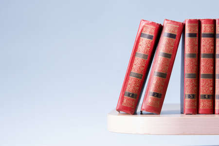 Open book, hardback books on wooden table. Back to school. Copy space.の写真素材