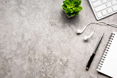White desk office with laptop, smartphone and other work supplies with cup of coffee. Top view with copy space for input the text. Designer workspace on desk table essential elements on flat lay.の写真素材