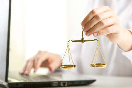 Lawyer working with contract papers and wooden gavel on tabel in courtroom. justice and law, attorney, court judge conceptの写真素材