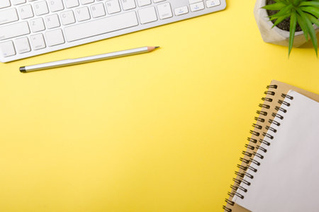 White desk office with laptop, smartphone and other work supplies with cup of coffee. Top view with copy space for input the text. Designer workspace on desk table essential elements on flat lay.の写真素材