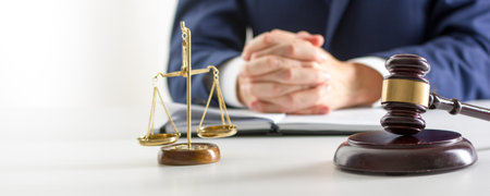 Lawyer working with contract papers and wooden gavel on tabel in courtroom. justice and law, attorney, court judge conceptの写真素材
