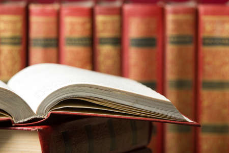 Open book, hardback books on wooden table. Back to school. Copy space.の写真素材