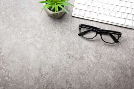 White desk office with laptop, smartphone and other work supplies with cup of coffee. Top view with copy space for input the text. Designer workspace on desk table essential elements on flat lay.の写真素材