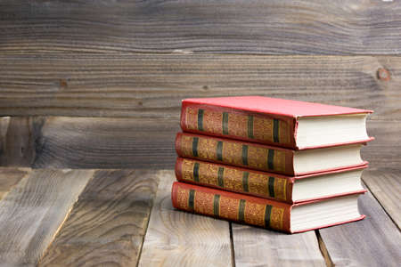 Old books on a wooden shelf. back to school.の写真素材