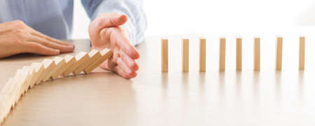 Plan and strategy in business, Risk To Make Business Growth Concept With Wooden Blocks, hand of man...