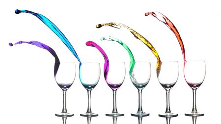 Colored liquid splashing out a glass on a white background
の写真素材