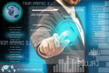 Business men touching a futuristic touchscreen interfaceの写真素材
