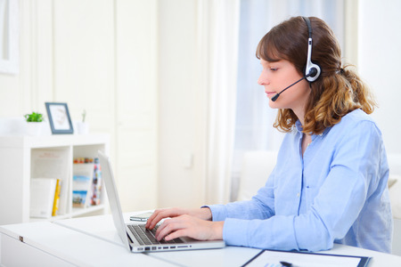 View of a young business woman working at homeの写真素材