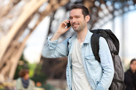 View of a Young attractive tourist phoning in Paris, Franceの写真素材