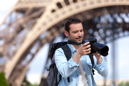View of a Young attractive tourist taking pictures in Paris, Franceの写真素材
