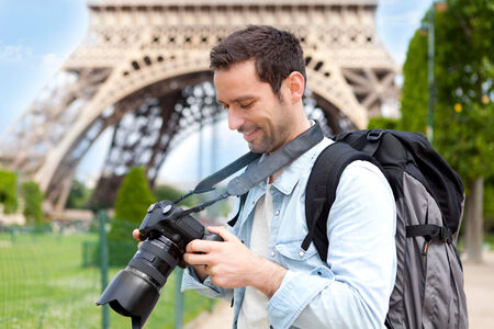 View of a Young attractive tourist taking pictures in Paris, Franceの写真素材