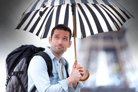 View of a Young attractive man suffering rain in PARIS in Parisの写真素材