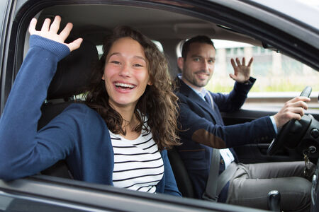 View of a Young business man couple in their brand new car の写真素材