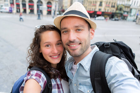 View of a Young couple on holidays taking selfieの写真素材