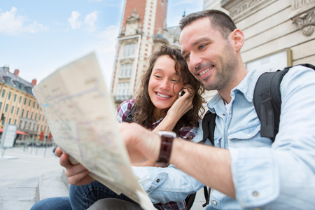 View of a Young couple of tourists booking hostelの写真素材