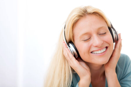 View of a young attractive woman listenning musicの写真素材