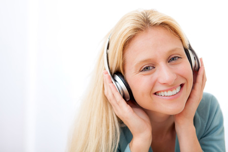 View of a young attractive woman listenning musicの写真素材