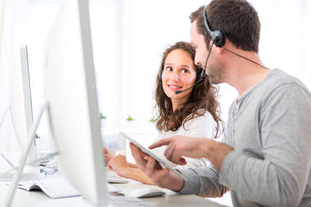 View of Co-workers on a call center having funの写真素材