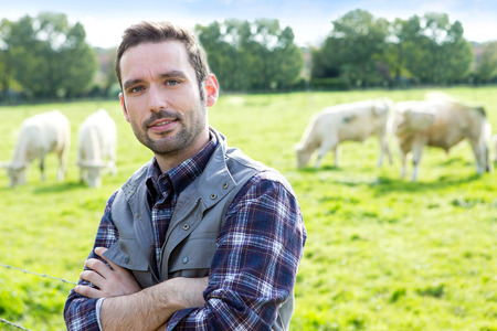 View of a Young attractive farmer working in a fieldの写真素材