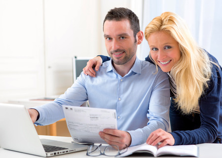 VIew of a Young attractive couple doing administrative paperworkの写真素材