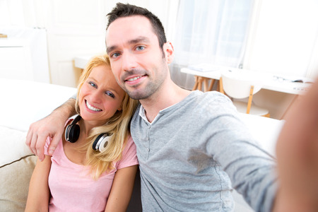 View of a Young attractive couple having fun doing selfieの写真素材