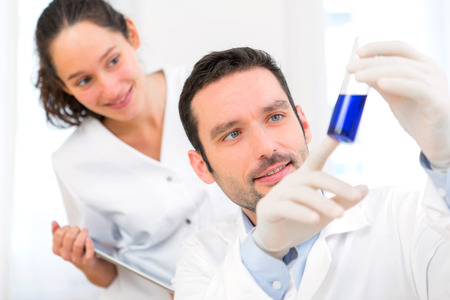 View of a Scientist and his assistant working in a laboratoryの写真素材