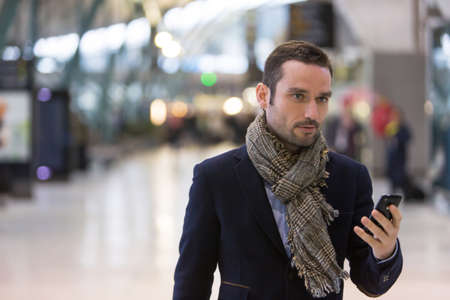 View of a Young attractive man transiting a railway stationの写真素材