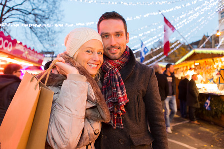 VIew of a Young attractive couple in a christmas marketの写真素材