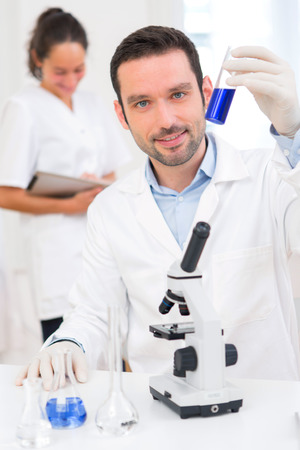 View of a Scientist and his assistant working in a laboratoryの写真素材