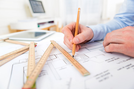 Close up view of an architect working at the officeの写真素材