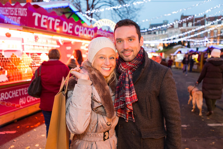 VIew of a Young attractive couple in a christmas marketの写真素材