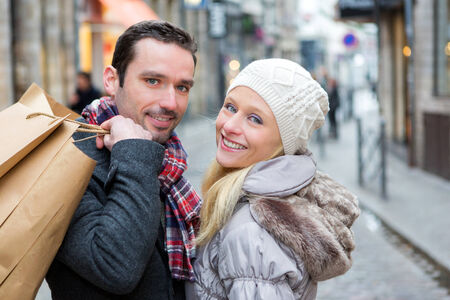 View of a Young attractive couple with shopping bagsの写真素材