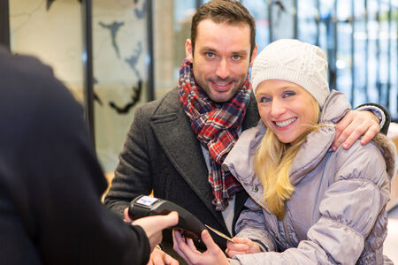 View of a Young attractive paying after shoppingの写真素材