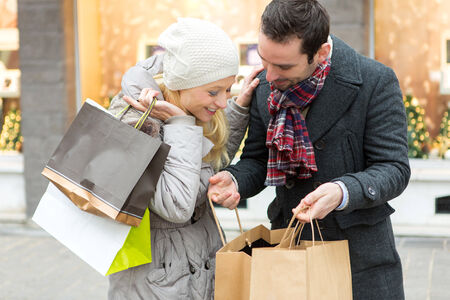 View of a Young attractive couple with shopping bagsの写真素材