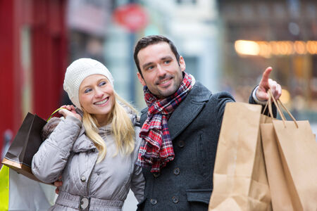View of a Young attractive couple with shopping bagsの写真素材