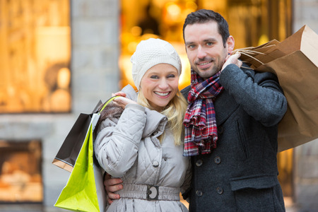 View of a Young attractive couple with shopping bagsの写真素材