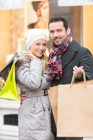 View of a Young attractive couple with shopping bagsの写真素材