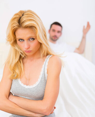 View of a Young attractive couple having an argue in bedの写真素材