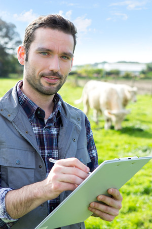 View of a Young attractive farmer working in a fieldの写真素材